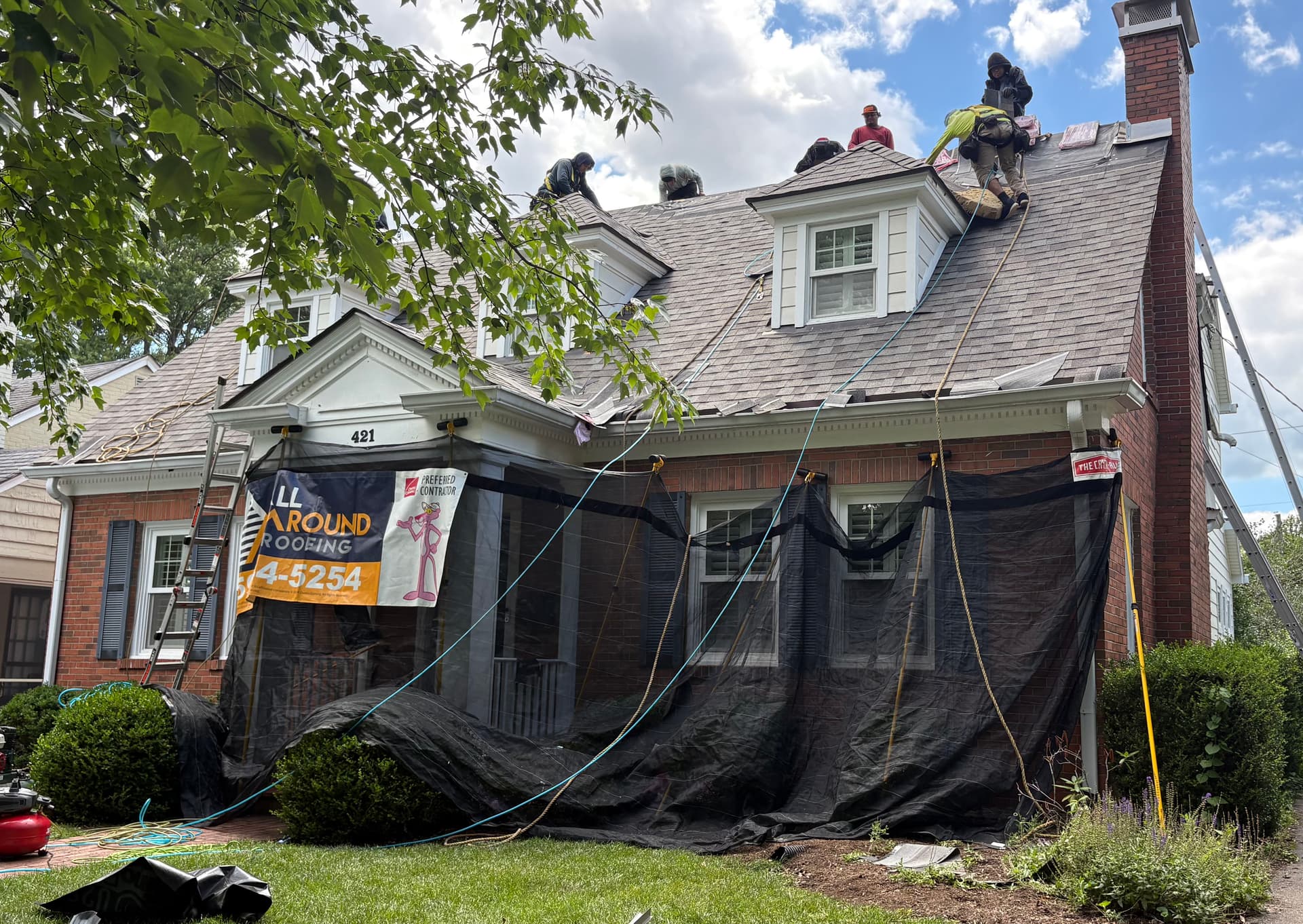 Duration Driftwood Shingles Give This Classic Brick Home a Fresh Roof image