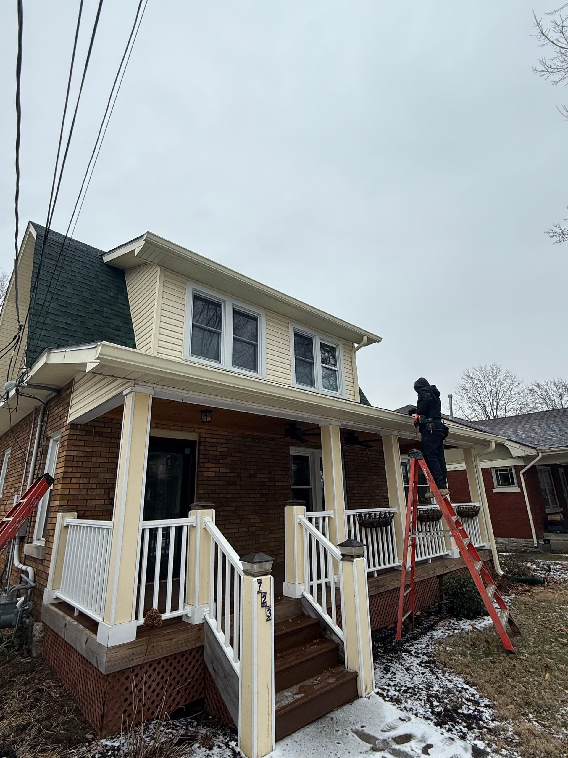 Snowy Day Gutter Installation in Lexington image