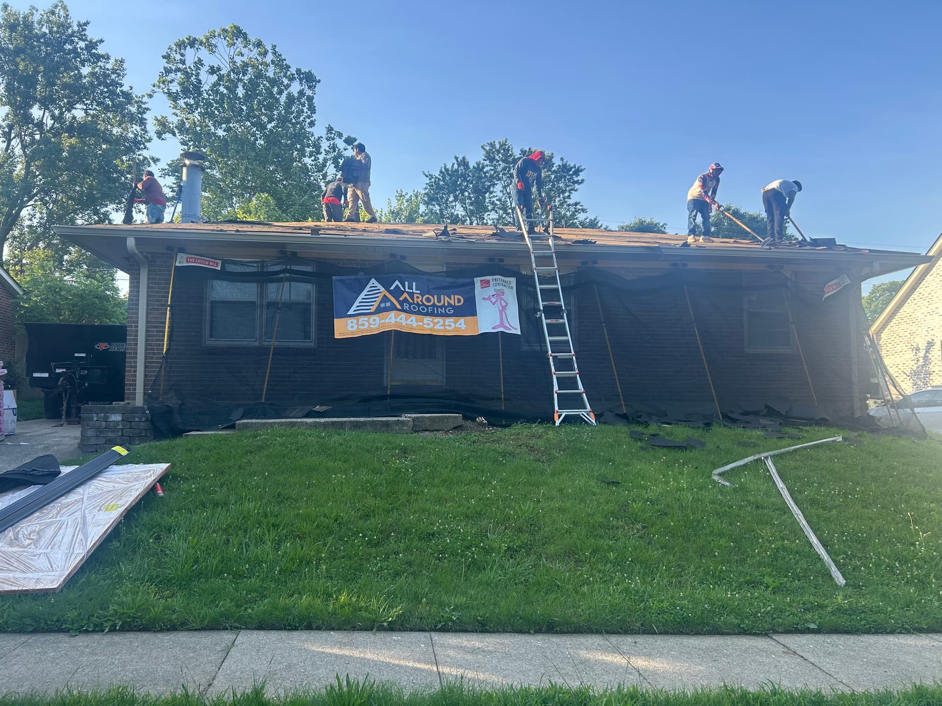 Full Crew on the Roof and Getting It Done Right image